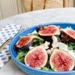 fresh figs salad with goat cheese on a blue plate