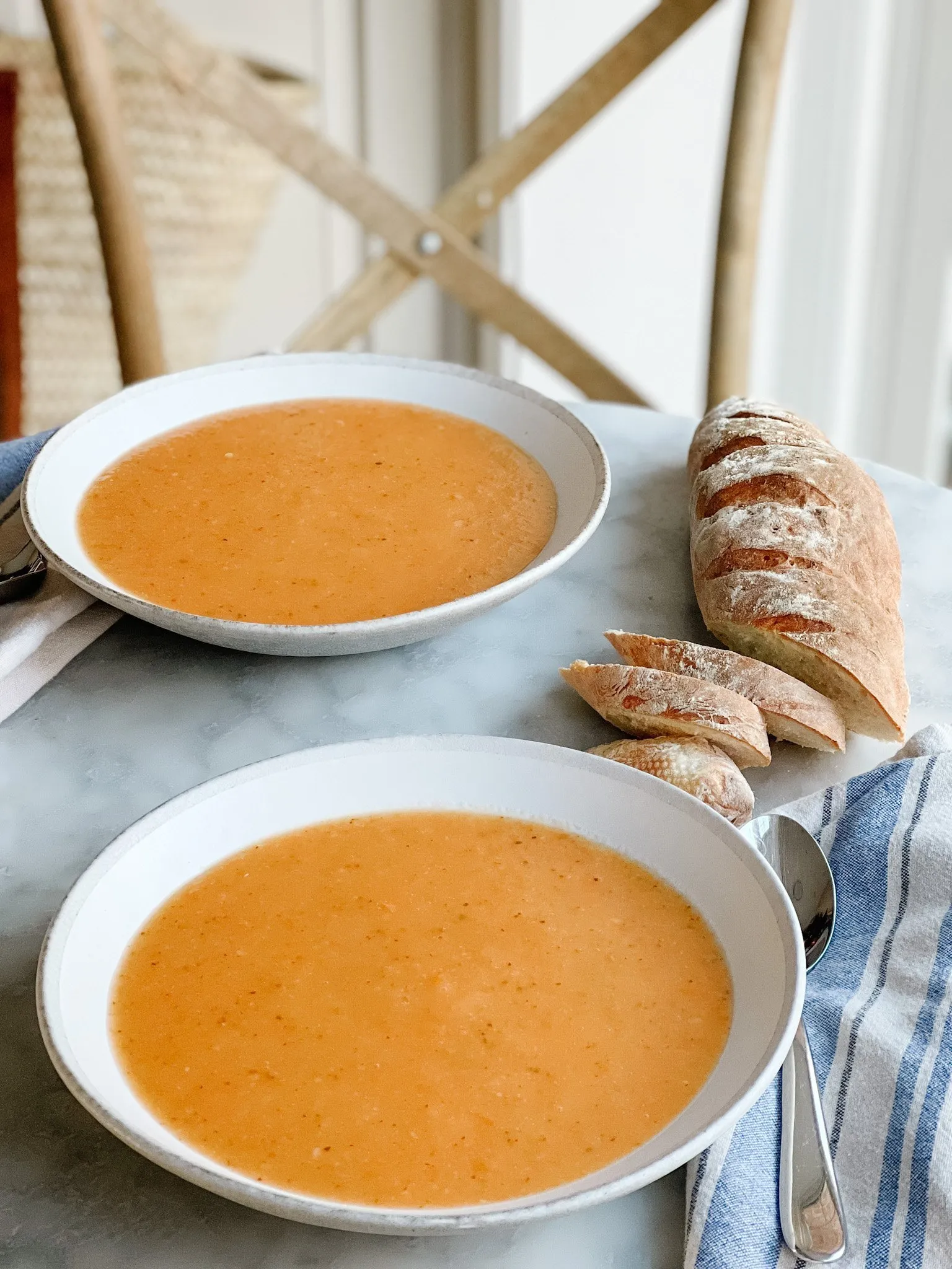 la Soupe de Mamie vegetable soup in two bowls with a baguette 2