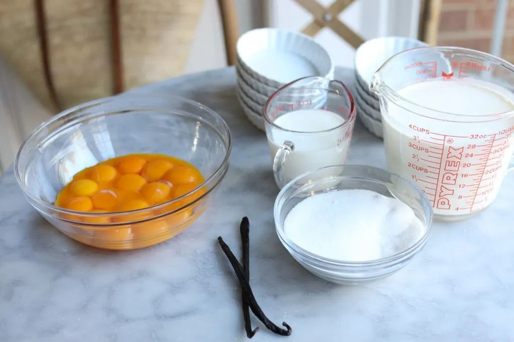 Ingredients for Crème brulée - eggs, sugar, milk and cream and vanilla bean