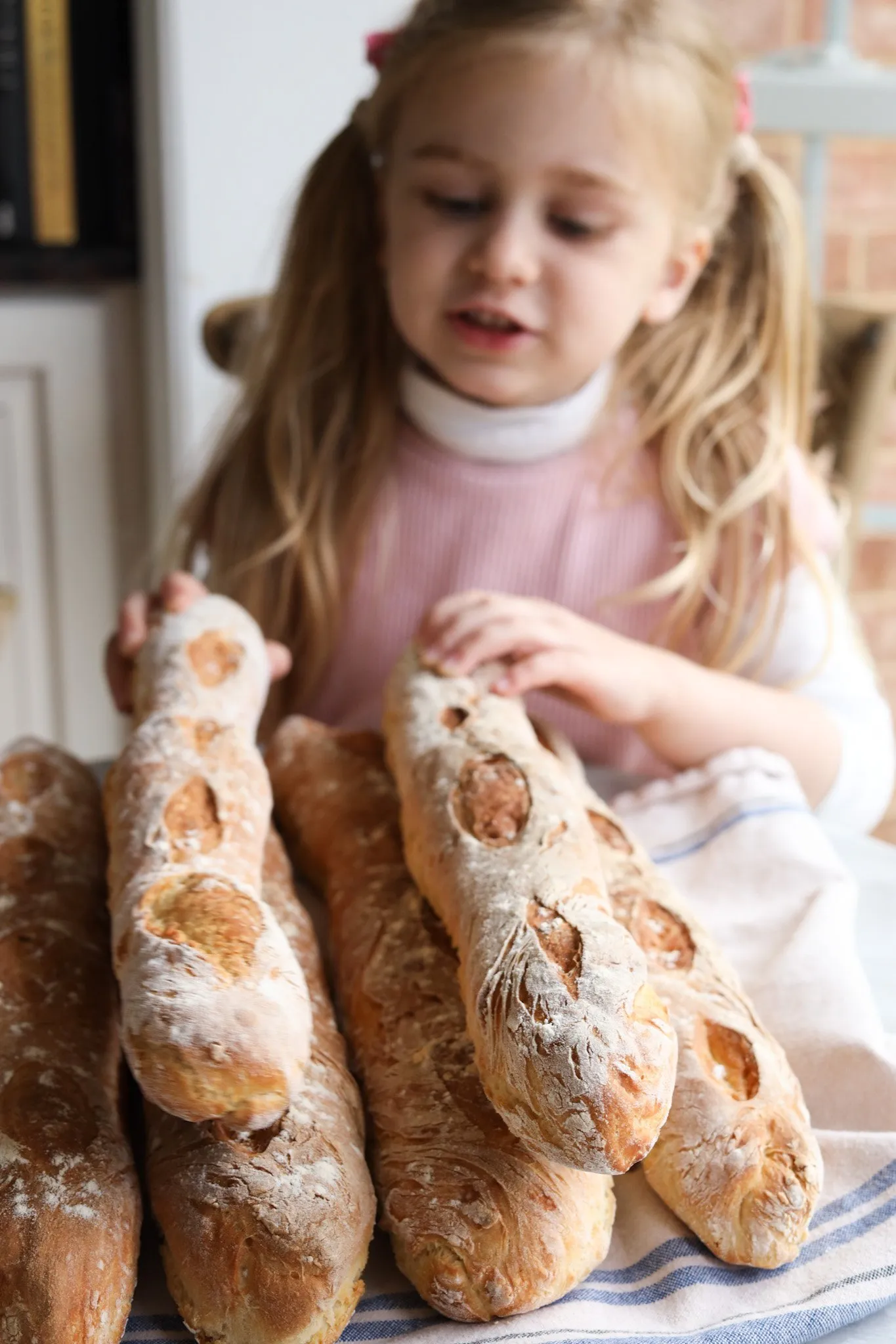 the author's daughter counting French Baguettes