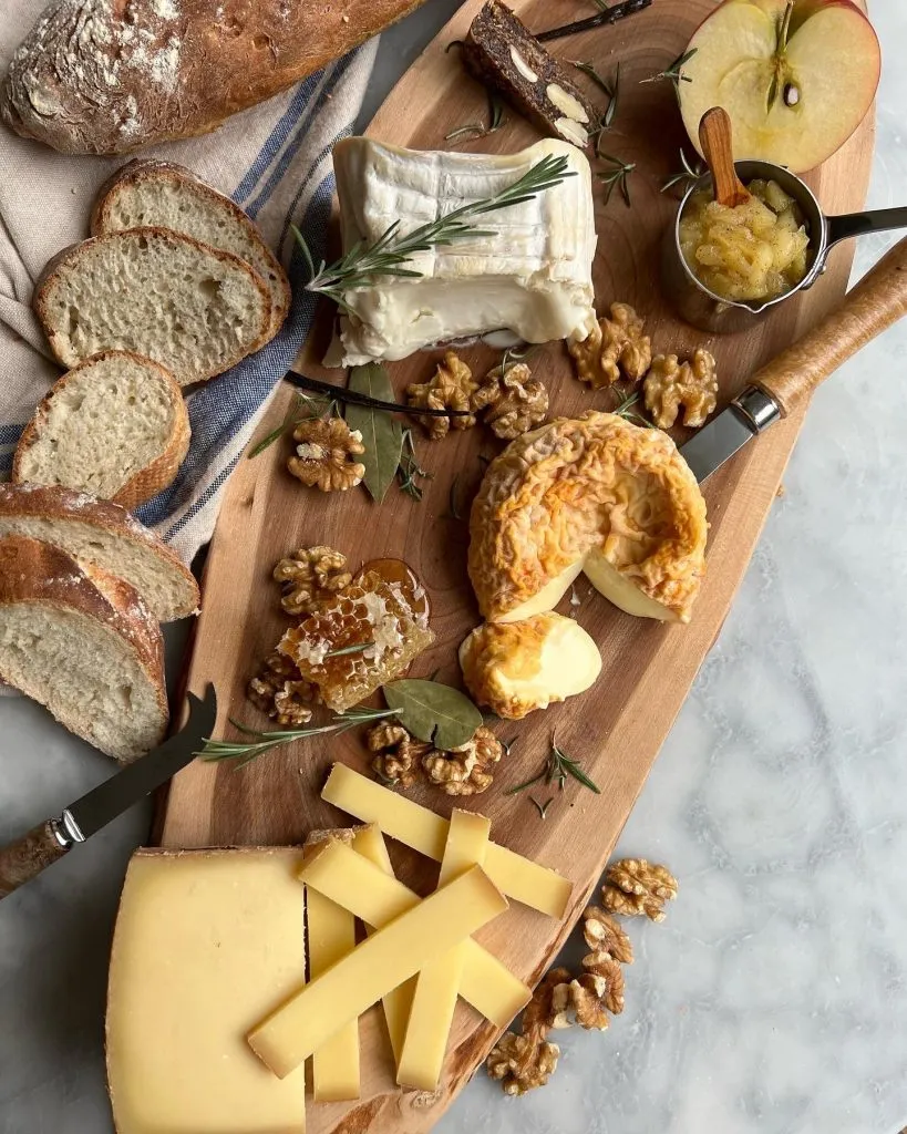 A cheese board with homemade French Baguettes