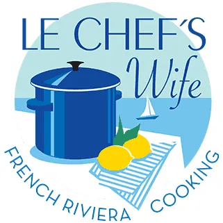 Le Chefs Wife logo a big blue stock pot next to the sea with lemons