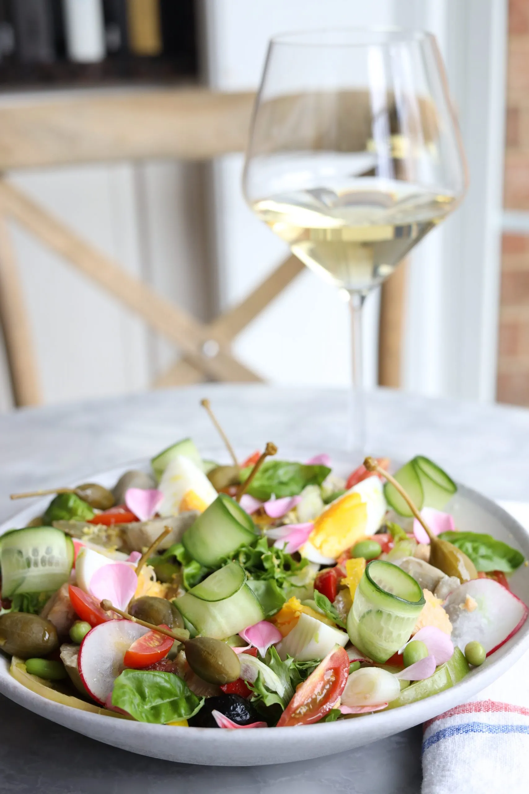 Nicoise salad - tomatoes, artichokes, capers, cucumbers olives and capers with tuna