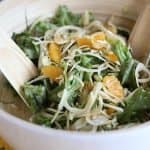 la salade mentonnaise : fennel, oranges, pine nuts, artichokes and greens in a serving bowl