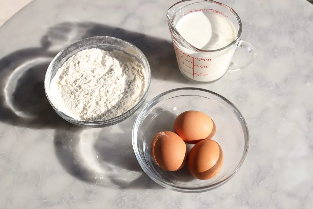 ingredients for crepes - flour, eggs and milk
