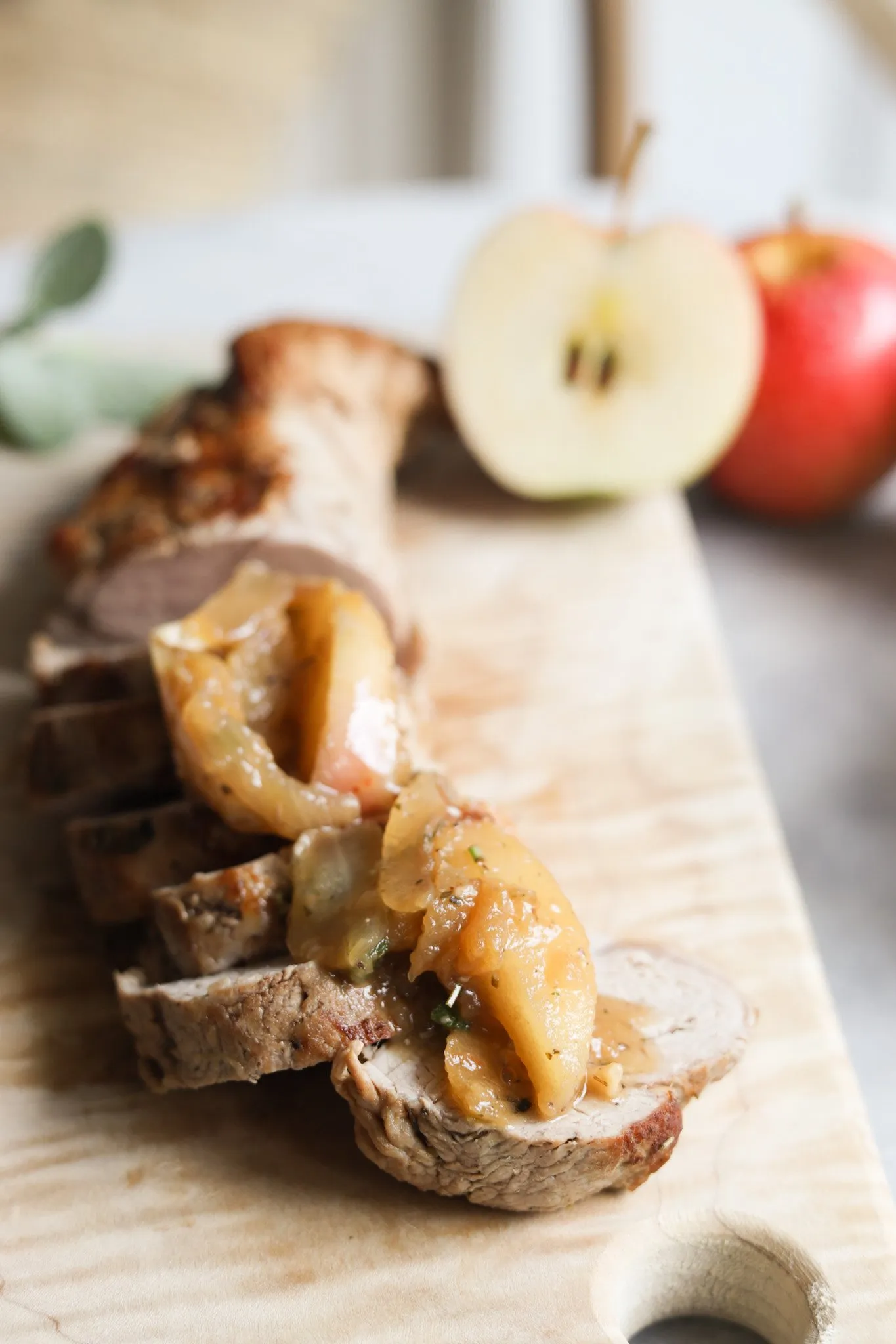 sliced pork tenderloin topped with roasted apples and sage