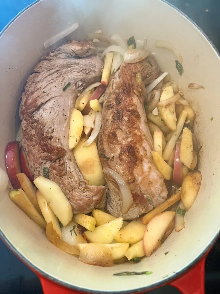 roast pork tenderloin in a dutch oven with apples