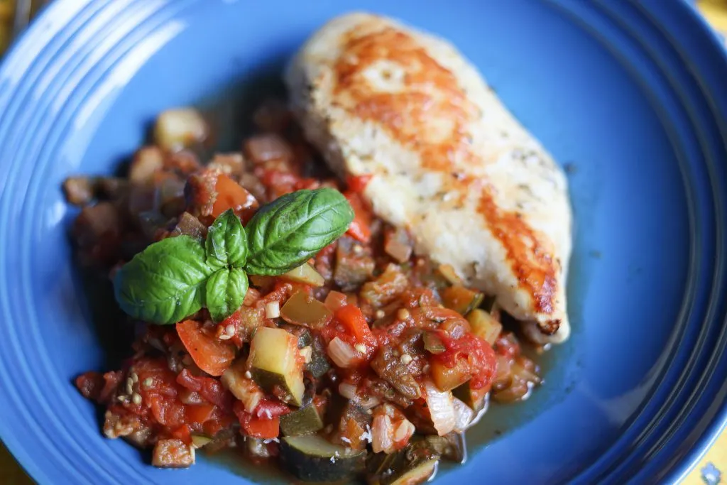 ratatouille served with a grilled chicken breast