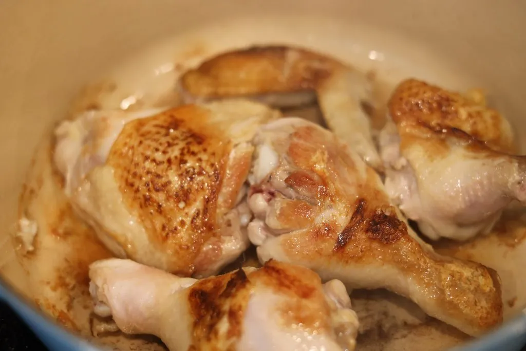 seared pieces of chicken for coq au vin