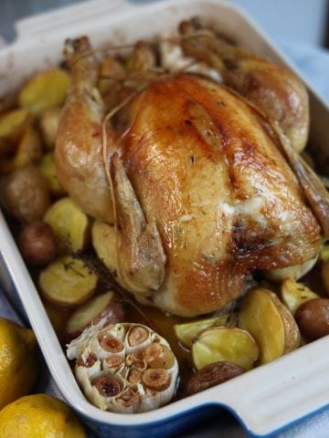 poulet roti - roast chicken with lemon and thyme and garlic fresh out of the oven