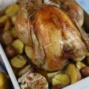 poulet roti - roast chicken with lemon and thyme and garlic fresh out of the oven