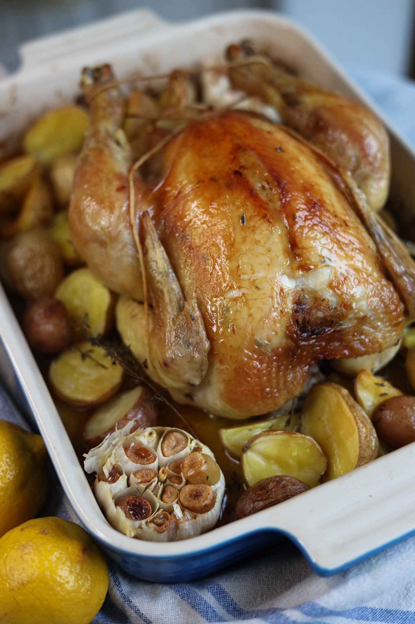 poulet roti - roast chicken with lemon and thyme and garlic fresh out of the oven