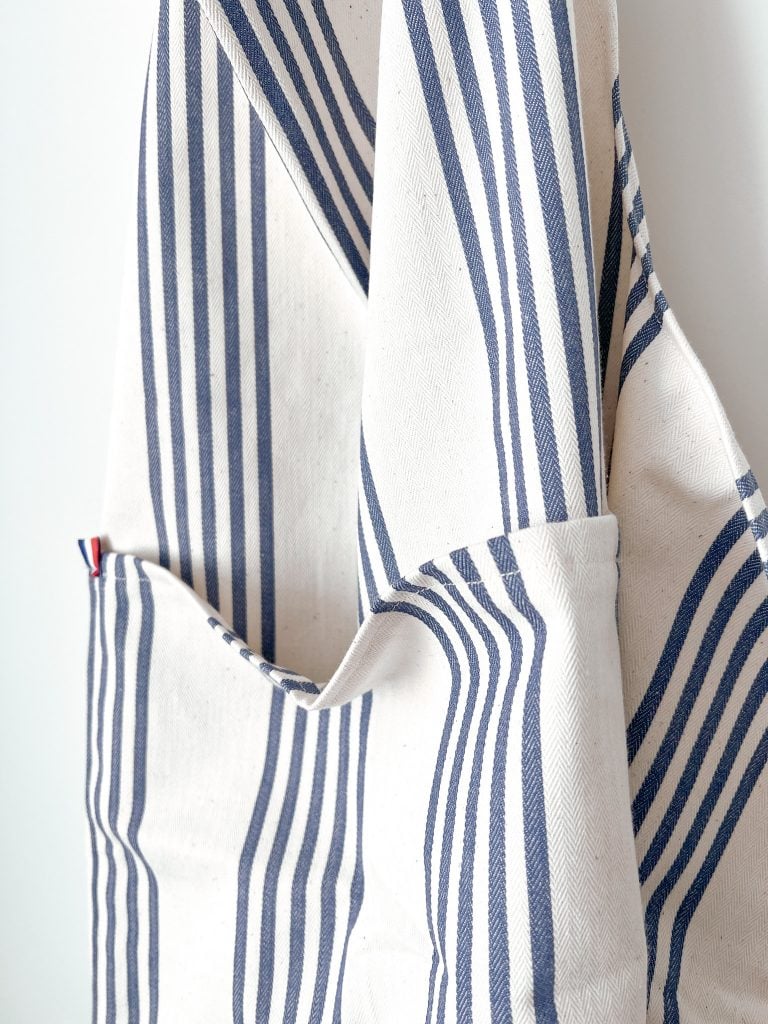 A blue and white stripe apron