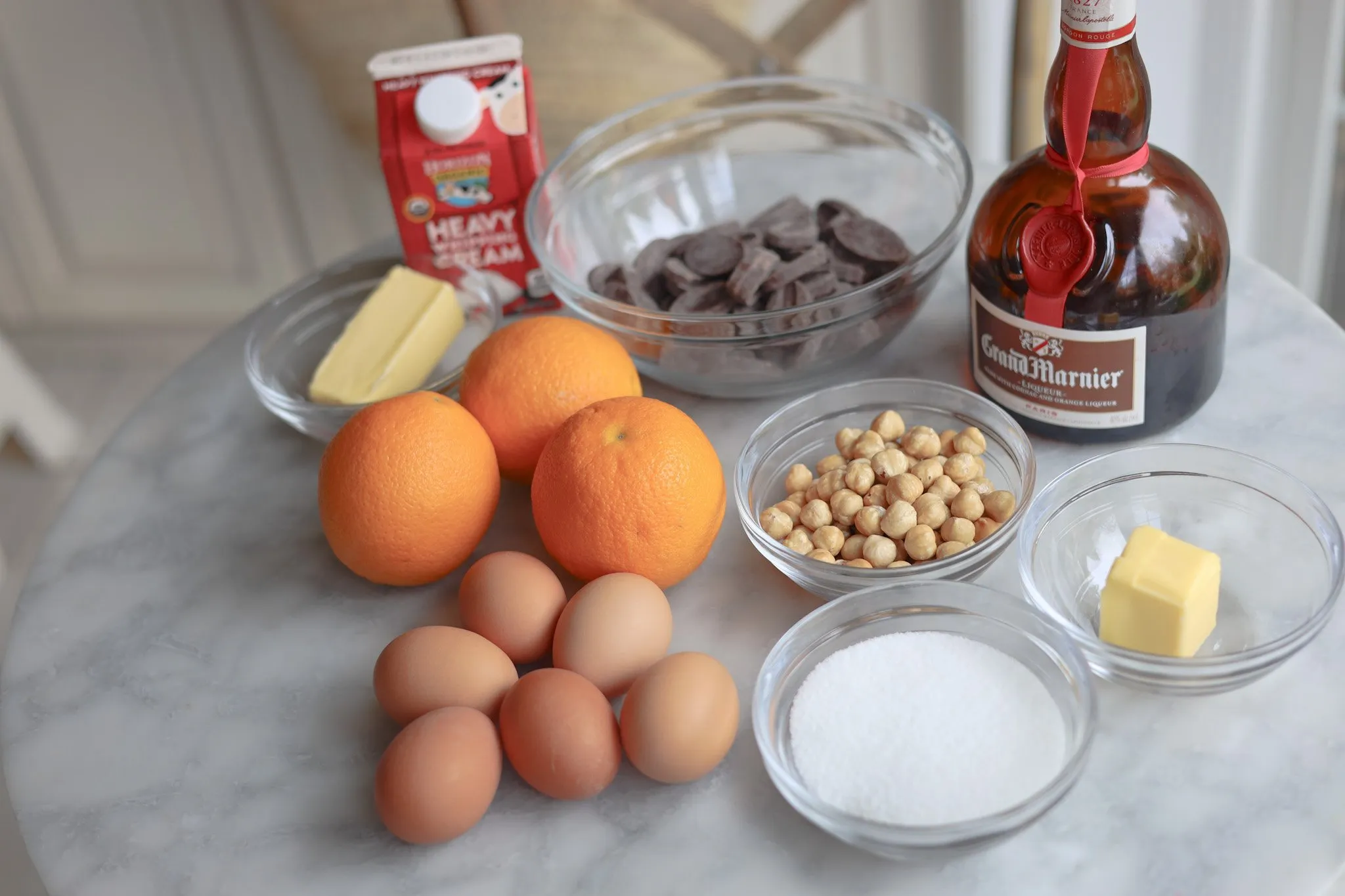 Making the Buche de Noel from scratch - ingredients oranges, butter, dark chocolate, butter, sugar, hazelnuts, grand marnier