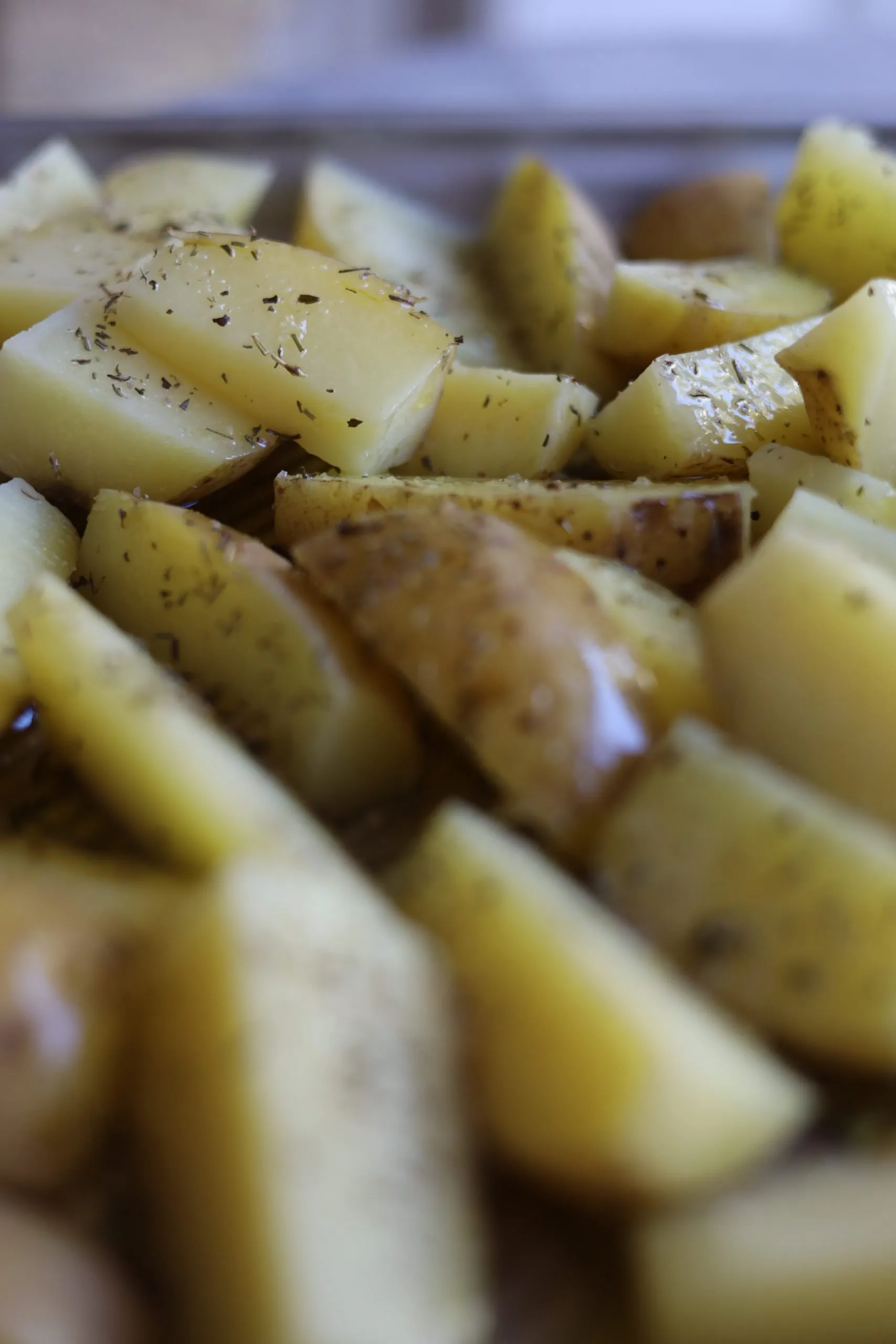 potatoes with herbes de provence ready to be roasted