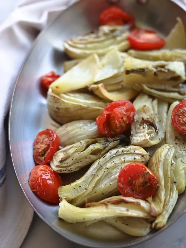 roasted fennel in a pan with tomatoes