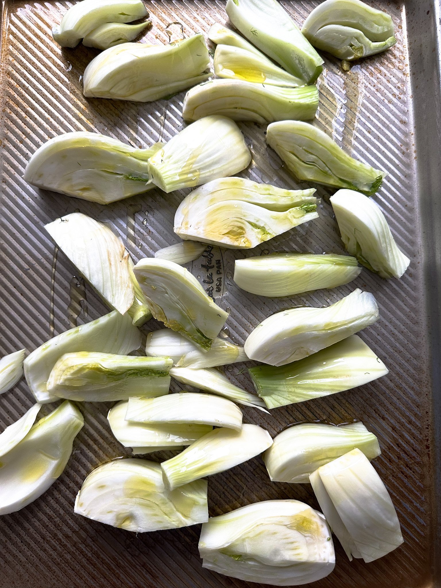 Roasted Fennel ready to roast in a pan with olive oil