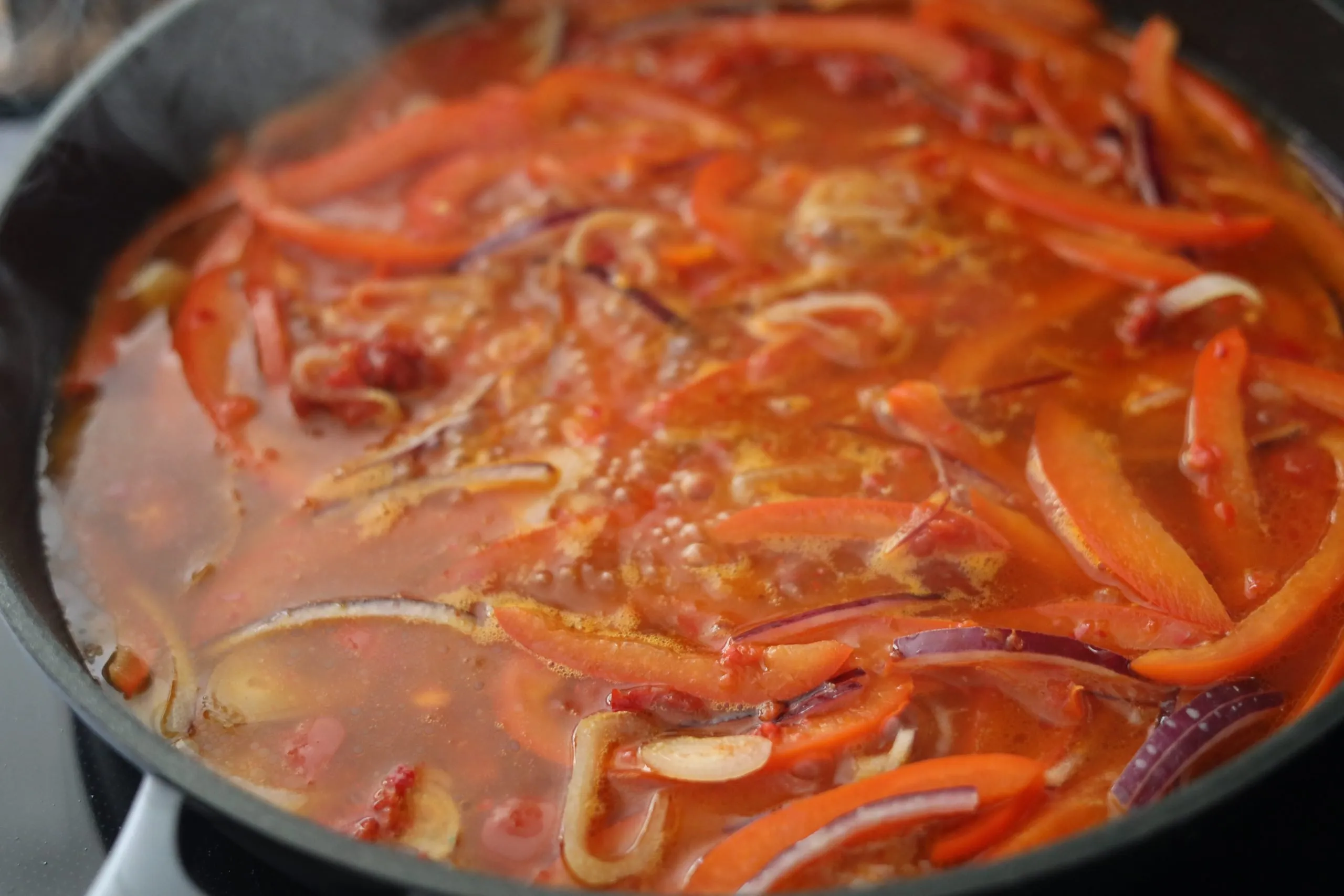 Piperade sauce in a pan