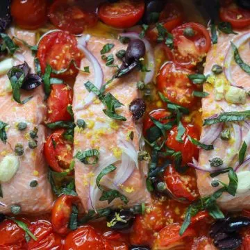 Mediterranean Salmon baked with tomatoes, garlic, basil, olives and capers