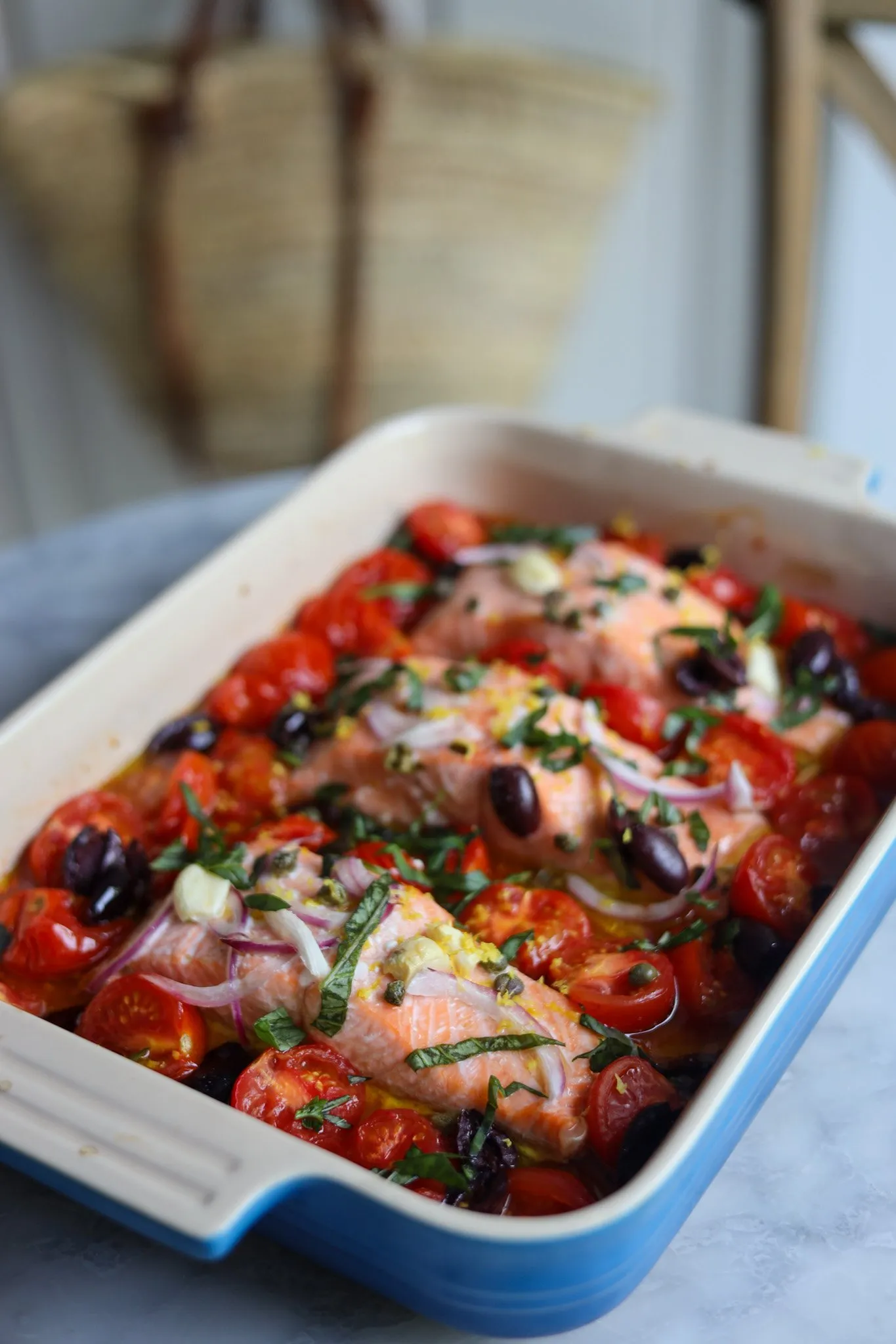Mediterranean Salmon baked with tomatoes, garlic, basil, olives and capers