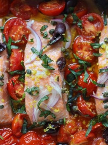 Mediterranean Salmon baked with tomatoes, garlic, basil, olives and capers