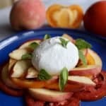 Peach caprese salad with peaches, tomatoes, burrata and basil