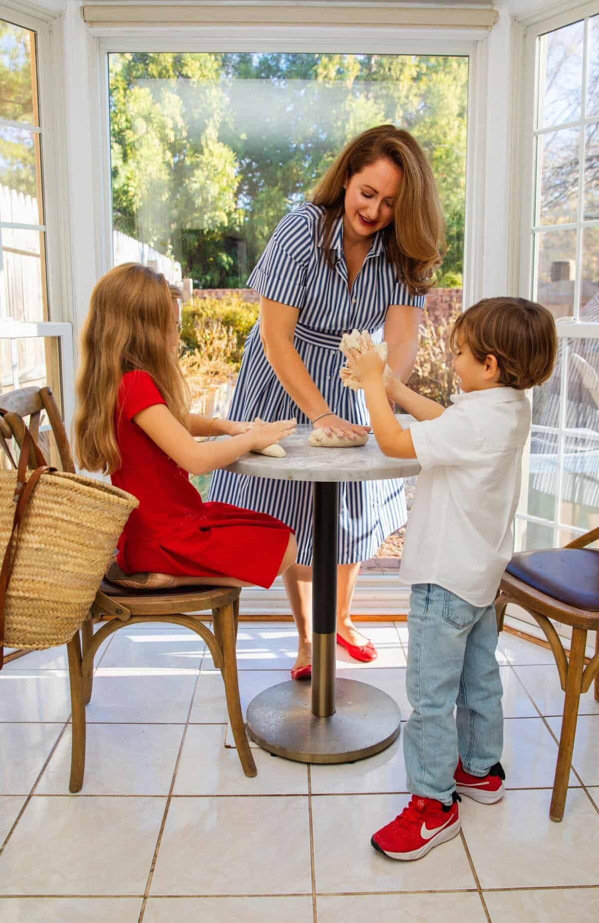 le chefs wife in her kitchen with her kids baking baguettes