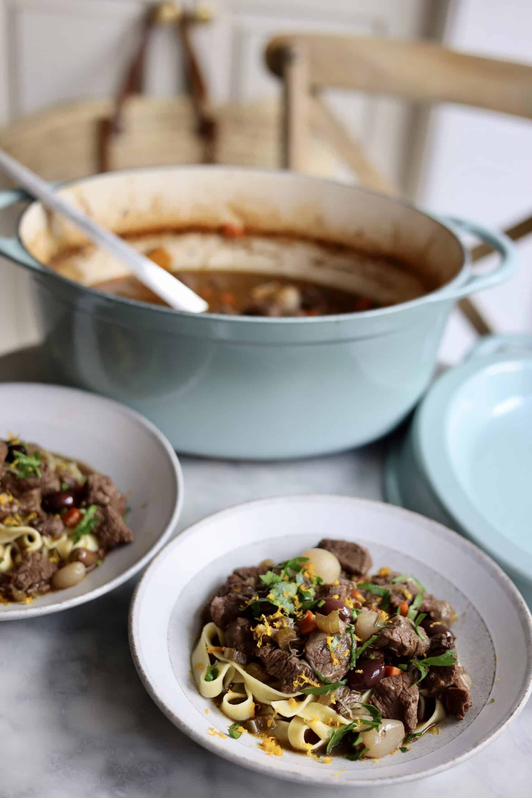 le creuset dutch oven and two bowls of daube provencal