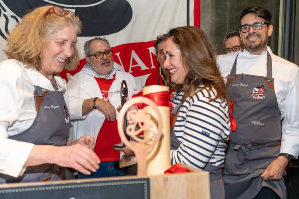 Le Chefs wife anina belle gainnini at the Cassoulet War competition receiving her award