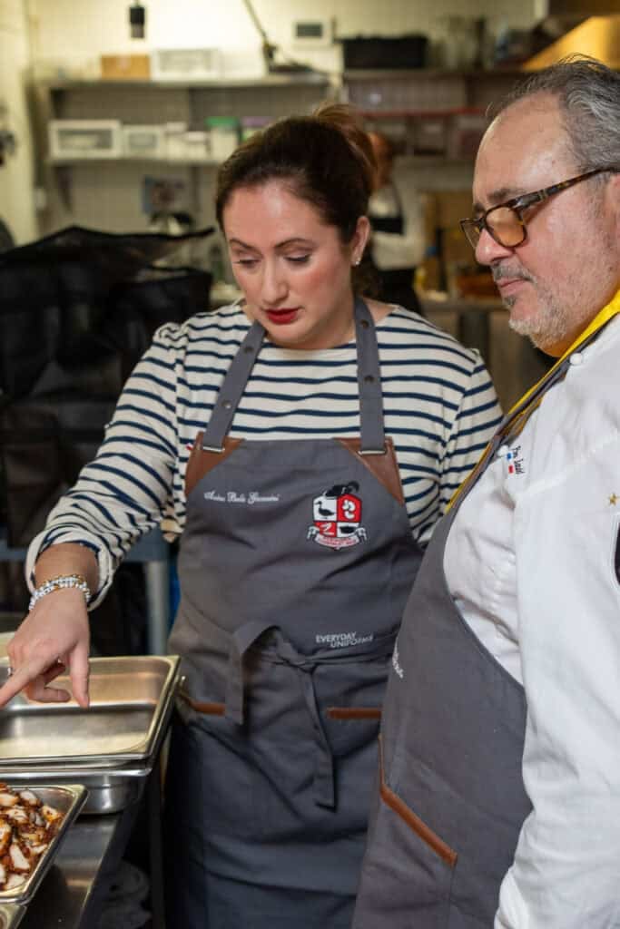 le chefs wife explaining her Cassoulet to Chef Pierre Landet in the D'Artagnan Cassoulet WAr