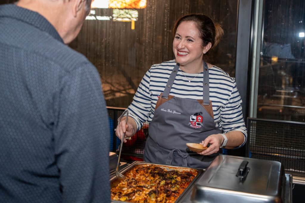 Le chef's wife serving cassoulet at the d'artagnan Cassoulet War