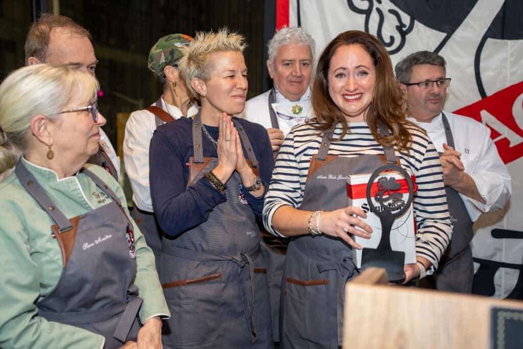 Dartagnan foods cassoulet war cooking competition winners on stage including le chefs wife with her award. judges Elizabeth Falkner and sara moulton