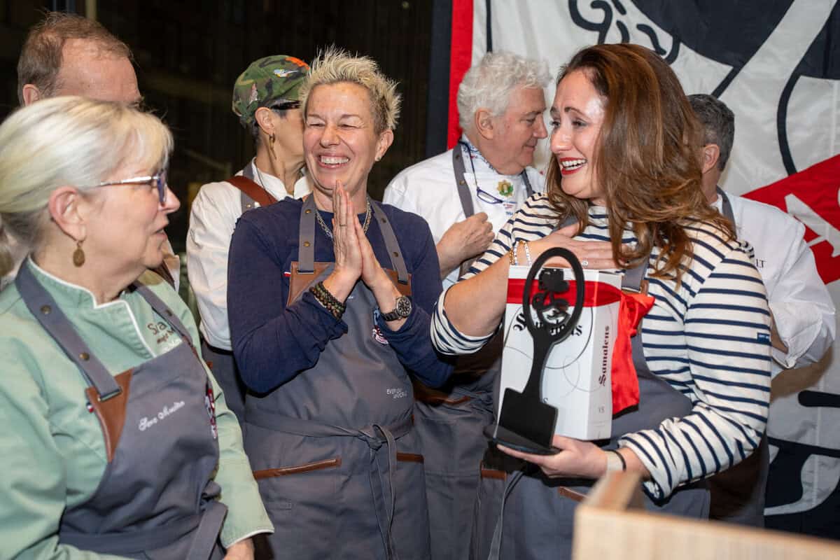 Dartagnan foods cassoulet war cooking competition winners on stage including le chefs wife with her award. judges Elizabeth Falkner and sara moulton