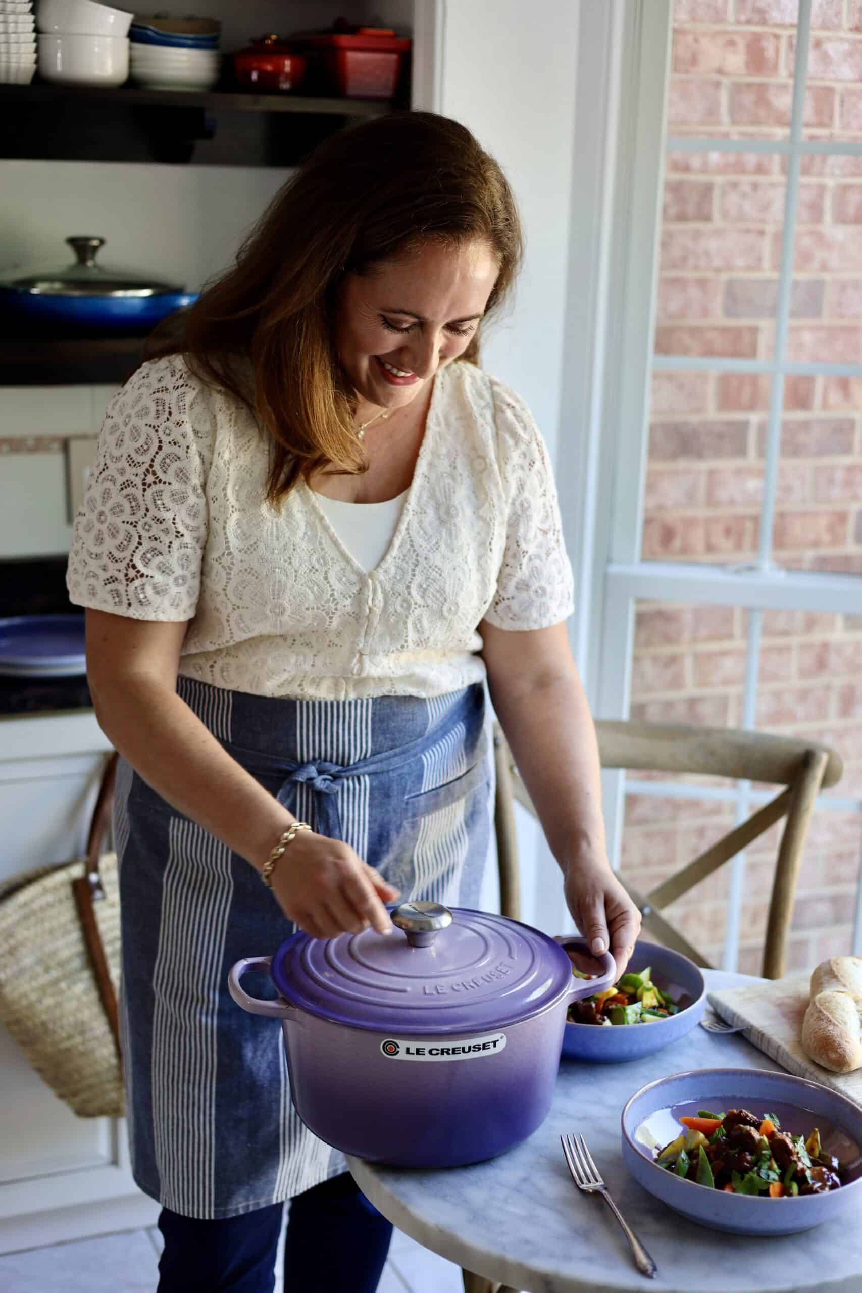 the author, le chefs wife in her kitchen with a purple Provence dutch oven and Navarin d'agneau lamb stew