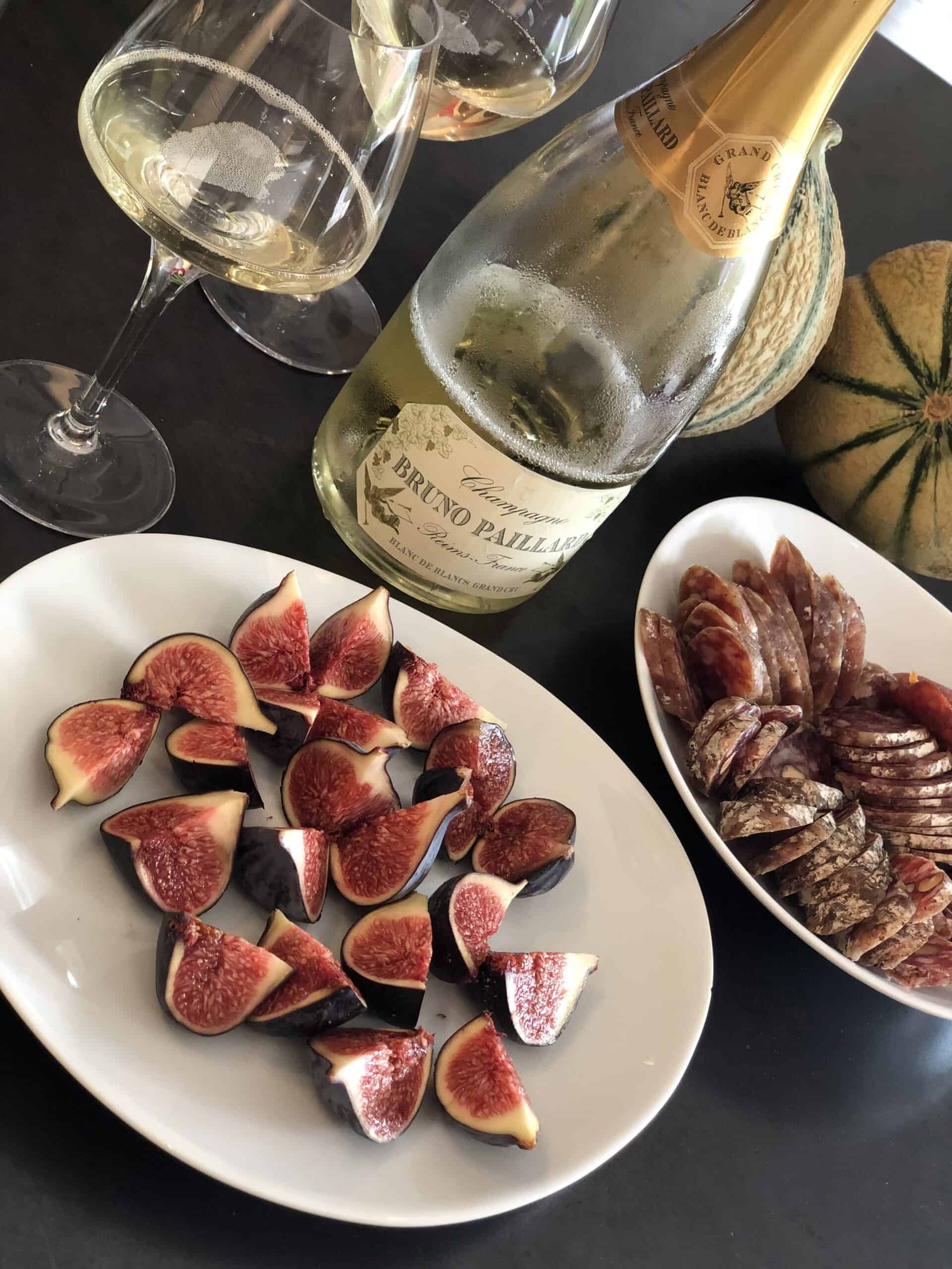 apero with champagne, figs, saucisson and melon on the french riviera