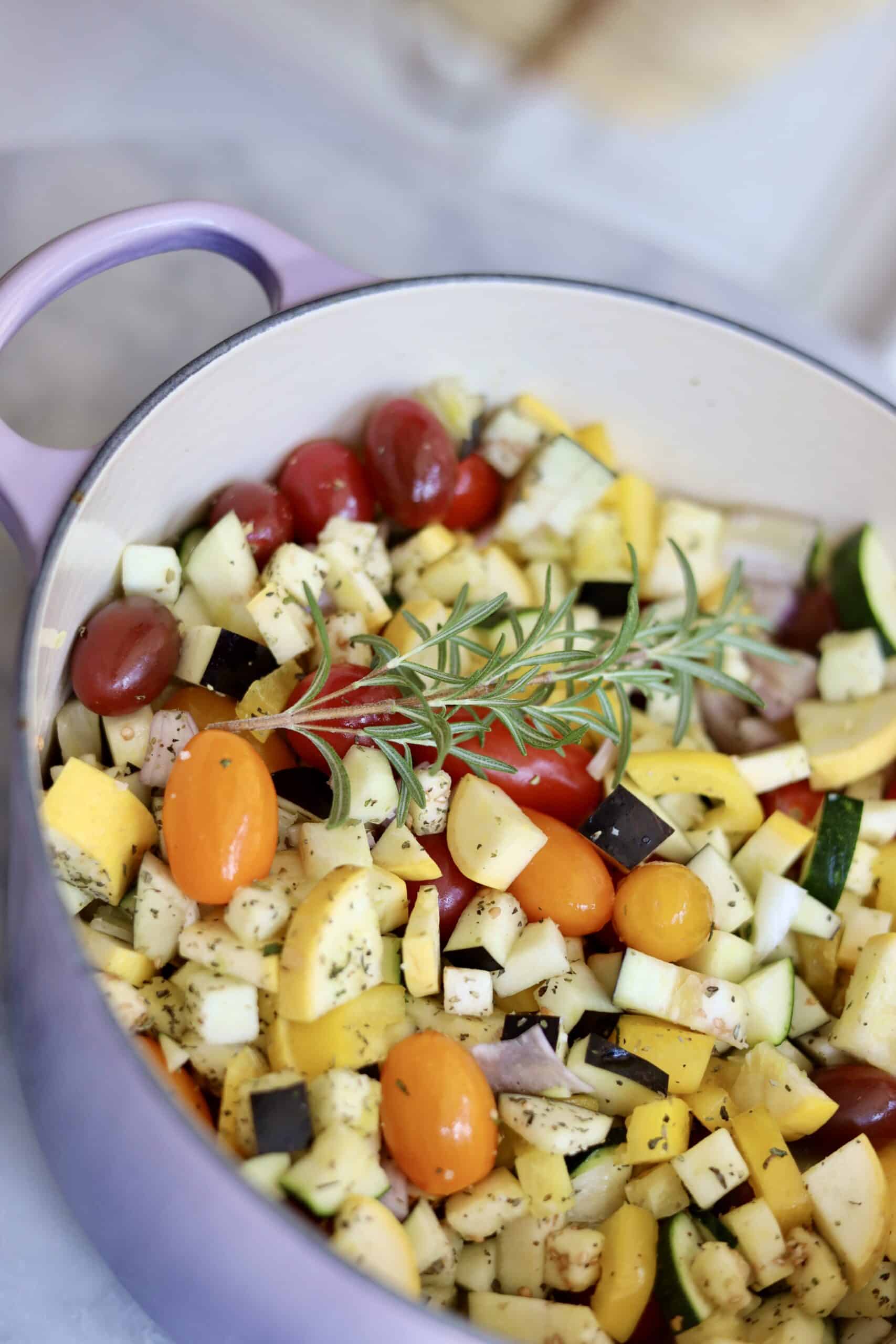 Provencal roast chicken ratatouille in a dutch oven - the chooped vegetables and herbs for the ratatouille