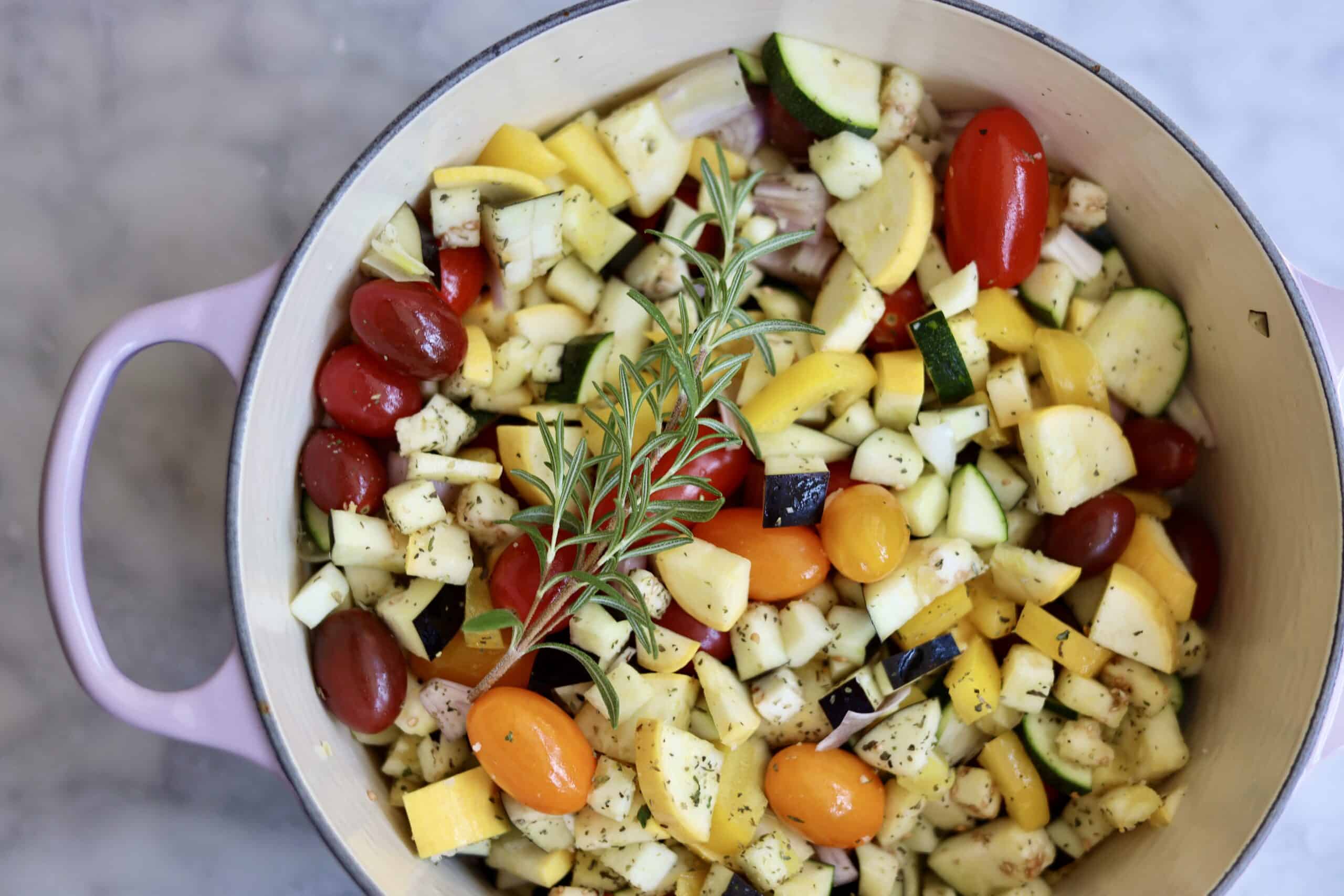 Provencal roast chicken ratatouille in a dutch oven - the chooped vegetables and herbs for the ratatouille